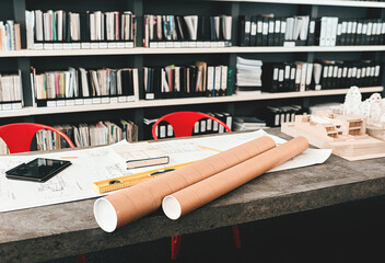 Poster - Documents, blueprint and equipment for architecture in office with model, design or property expansion. Paperwork, tech and workspace for floor plan, draft or rolls in interior at construction agency