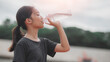 © FAMILY STOCK - A girl drinking water from a bottle