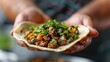 © cloud7days - A street food vendor expertly assembling a taco al pastor.