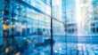 © Best_Seller - Blue glass windows in a modern building with a blurred background create an abstract effect.