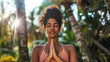 © Mirjana - Woman practicing yoga in a tropical forest setting