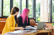 © Charlie's - LGBTQ+ transgender man Beautiful Authentic Specialist with Pink Hair and Non-binary trans working together Working Design in creative workplace team work colleagues Gender equality