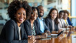 © Chatchanan - Smiling employees of a diverse law firm gathered around a conference table, exuding teamwork and unity.