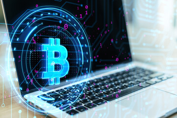 Wall Mural - Close up of laptop with digital bitcoin sign on blurry background. Digital banking, technology and cryptocurrency concept. 3D Rendering.