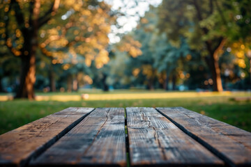 Poster - Empty wooden picnic table with blurred park background, perfect for product display