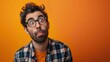 © furyon - expressive portrait of perplexed man against vibrant orange backdrop dynamic composition highlighting facial features and emotions with bold color contrast