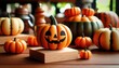 © Anupong - A smiling plastic jack-o'-lantern sits on a wooden block surrounded by other decorative pumpkins of various sizes and shapes..Concept: Festive Halloween Decoration