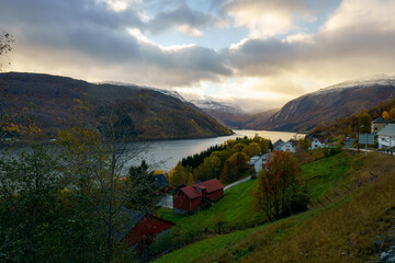 A beautiful valley featuring a lake and towering mountains in the distance