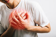 © sorapop - Portrait Asian young man holding his arms around his chest suffering because of a heart attack studio isolated white background, Happy lifestyle men chest pain health discomfort heart problems