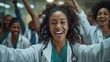 © okfoto - Group of doctors and nurses celebrating success in hospital corridor. Smiling, laughing, and showing excitement, they embody care and support in scrubs and stethoscopes