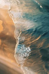 Poster - A picturesque view of a sunlit shoreline featuring gentle waves washing onto golden sand, capturing the serene beauty and tranquility of a perfect coastal landscape.