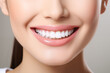 © Pakhnyushchyy - Perfect healthy teeth smile of a young woman. Teeth whitening. Dental care, stomatology concept.