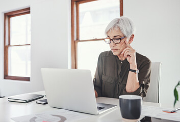 Poster - Laptop, planning and mature woman in office checking email, online report or market research on website. Reading, thinking and creative businesswoman at desk working on agenda for business growth
