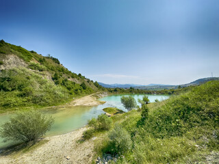 A wonderful landscape in the Carpathian mountains with a view of the lake between the rocks in sunny weather