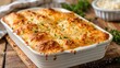 © pngking - Cheese bread in a white serving dish on a wooden table