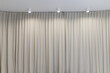 © Olena Svechkova - Light curtain that dropped down as a straight line with light bulbs on the ceiling. Background for inserting text, empty spaces.