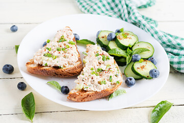 Wall Mural - Toasts with tuna. Italian bruschetta sandwiches with pate canned tuna, egg and cucumber.