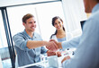 © peopleimages.com - Office, businessman and handshake in consulting with couple for investment, planning and success. Happy, people and financial advisor with gesture for business deal, negotiation and equity agreement