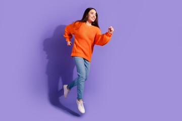 Poster - Photo of funny nice positive adorable girl wear stylish clothes run fast empty space isolated on violet color background