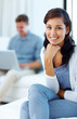 © Stigur/peopleimages.com - Portrait, happy and woman on sofa for relax, wellness and morning in living room or home. Female person, smile and calm or mindfulness on couch with man in lounge for marriage or together on weekend