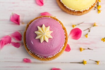 Sticker - Cute sweet delicious cupcake on desk on pastel background