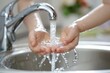 © kittipoj - Refreshing Childhood Moments - Child's hands under a stream of clean faucet water symbolizing purity and joy