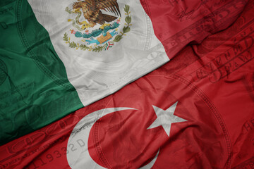 Canvas Print - waving colorful flag of mexico and national flag of turkey on the dollar money background. finance concept.