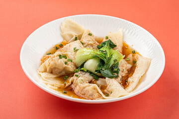 Wall Mural - Portion of appetizing asian wonton dumplings with bok choi