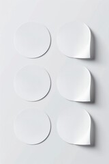 Poster - A group of white paper circles on a white surface, great for illustrations and designs