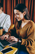© BullRun - Successful female copywriters creating articles for website using good internet connection on laptop devices, positive women chatting with followers in social networks sitting together at coffee shop