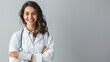 © SITI - Confident Female Doctor with Stethoscope Standing Against White Background