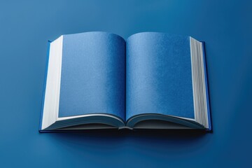 Canvas Print - A blue book lying on a blue surface, perfect for educational or office settings