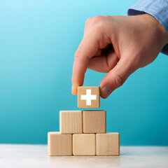Poster -  Value Add Concept- A hand places a wooden cube with a plus sign on a light blue backgro_1(329)