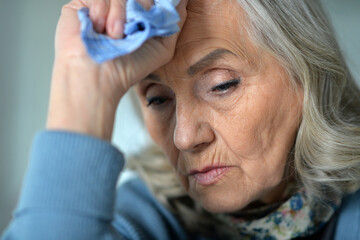 close up portrait of a sick senior woman