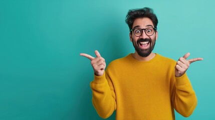 Canvas Print - Cheerful man wearing glasses and a yellow sweater, pointing in both directions against a turquoise background.