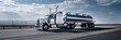 © Elmira - A silver tanker truck drives on a highway under a clear blue sky with white clouds. The truck is traveling in the right lane and the road stretches out in the distance