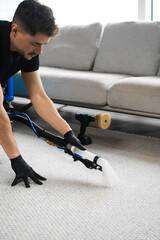 Wall Mural - Smearing detergent deep into fibers to clean carpet with drill and brush. Cleaning the carpet at home using drill and brush. Easy removal of stains on carpet with drill and brush.