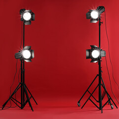 Wall Mural - Red photo background and professional lighting equipment in studio