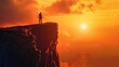 © daniel - Man standing on top of cliff at sunset