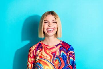 Sticker - Photo of positive cheerful adorable funky girl with bob hairstyle dressed print shirt loughing isolated on turquoise color background