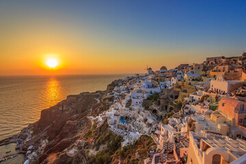 Breathtaking view over Oia village in Santorini island at sunset. Santorini, Cyclades, Greece.