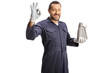 © Ljupco Smokovski - Car mechanic holding engine oil bottle and gesturing ok sign
