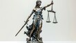 © Ghiska - Lady justice statue holding scales and sword, bronze finish, solid white background.