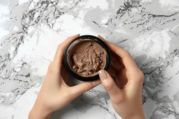 Sticker - Top view of female hands holding chocolate protein powder and shaker for muscle growth drink preparation on white table