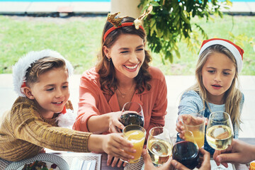 Canvas Print - Cheers, mom and kids at Christmas with glass, bonding and happy family celebration together for lunch. Toast, mother and children at table for festive holiday event with love, smile and fun at home