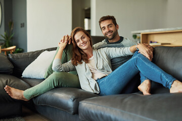 Poster - Couple, home and happy on sofa in living room for bonding, care and support as lovers. People, portrait and smile with confidence for relationship on couch in love on break, relax and rest in comfort