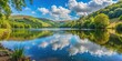 © Udomner - Tranquil lakeside view in Dale, South Wales, UK during the summer, nature, water, reflection, serene, peaceful, landscape