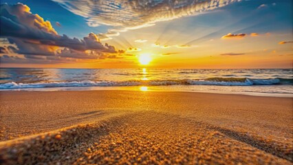 Wall Mural - sandy beach at sunset with warm hues reflecting off the grains, beach, sunset, warm, hues, reflectin