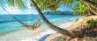 © indyntk - Gentle waves lapping on a secluded beach with a hammock swaying gently under palm trees