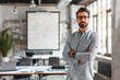 © BetterPhoto - A confident businessman standing with arms crossed in a modern office setting, ready for a presentation or meeting.